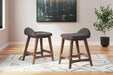 Lyncott Counter Height Bar Stool - Premium Barstool from Ashley Furniture - Just $92.51! Shop now at Furniture Wholesale Plus  We are the best furniture store in Nashville, Hendersonville, Goodlettsville, Madison, Antioch, Mount Juliet, Lebanon, Gallatin, Springfield, Murfreesboro, Franklin, Brentwood