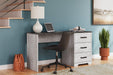 Shawburn 54" Home Office Desk - Premium Desk from Ashley Furniture - Just $176.01! Shop now at Furniture Wholesale Plus  We are the best furniture store in Nashville, Hendersonville, Goodlettsville, Madison, Antioch, Mount Juliet, Lebanon, Gallatin, Springfield, Murfreesboro, Franklin, Brentwood