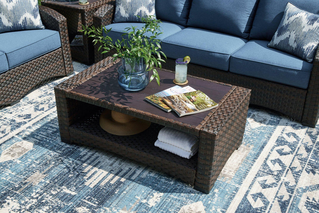 Windglow Outdoor Coffee Table - Premium Outdoor Cocktail Table from Ashley Furniture - Just $280.92! Shop now at Furniture Wholesale Plus  We are the best furniture store in Nashville, Hendersonville, Goodlettsville, Madison, Antioch, Mount Juliet, Lebanon, Gallatin, Springfield, Murfreesboro, Franklin, Brentwood