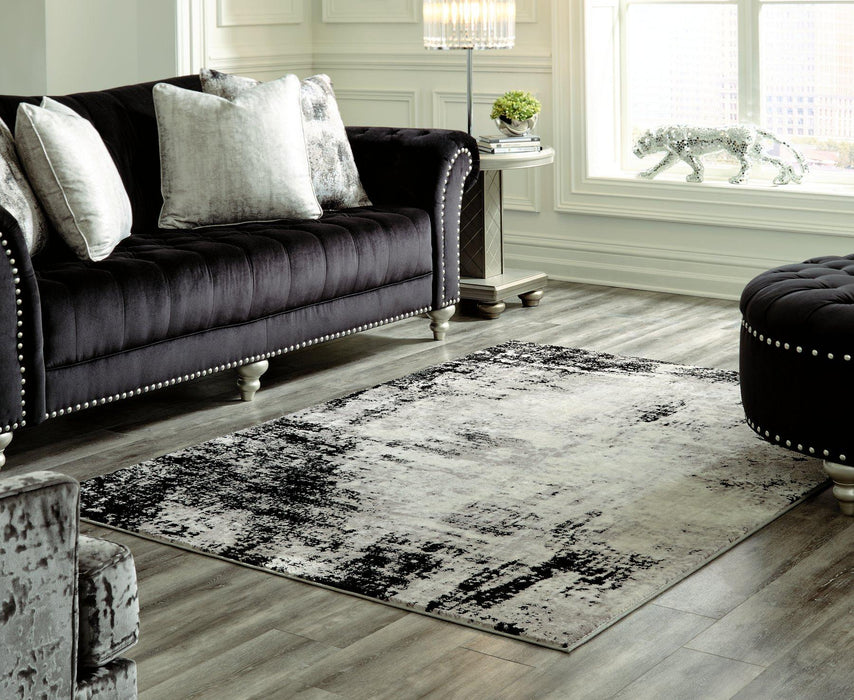 Zekeman 7'10" x 10' Rug - Premium Rug from Ashley Furniture - Just $249.76! Shop now at Furniture Wholesale Plus  We are the best furniture store in Nashville, Hendersonville, Goodlettsville, Madison, Antioch, Mount Juliet, Lebanon, Gallatin, Springfield, Murfreesboro, Franklin, Brentwood