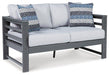 Amora Outdoor Loveseat with Cushion - Premium Outdoor Seating from Ashley Furniture - Just $606.48! Shop now at Furniture Wholesale Plus  We are the best furniture store in Nashville, Hendersonville, Goodlettsville, Madison, Antioch, Mount Juliet, Lebanon, Gallatin, Springfield, Murfreesboro, Franklin, Brentwood