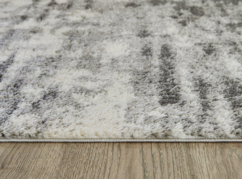 Gerdie 7'10" x 10' Rug - Premium Rug from Ashley Furniture - Just $203.86! Shop now at Furniture Wholesale Plus  We are the best furniture store in Nashville, Hendersonville, Goodlettsville, Madison, Antioch, Mount Juliet, Lebanon, Gallatin, Springfield, Murfreesboro, Franklin, Brentwood