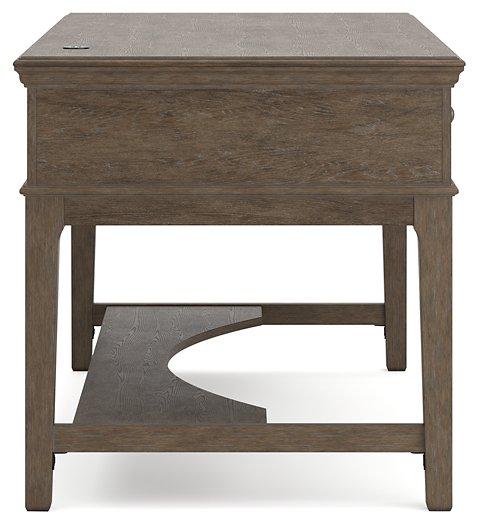 Janismore Home Office Storage Leg Desk - Premium Desk from Ashley Furniture - Just $579.20! Shop now at Furniture Wholesale Plus  We are the best furniture store in Nashville, Hendersonville, Goodlettsville, Madison, Antioch, Mount Juliet, Lebanon, Gallatin, Springfield, Murfreesboro, Franklin, Brentwood