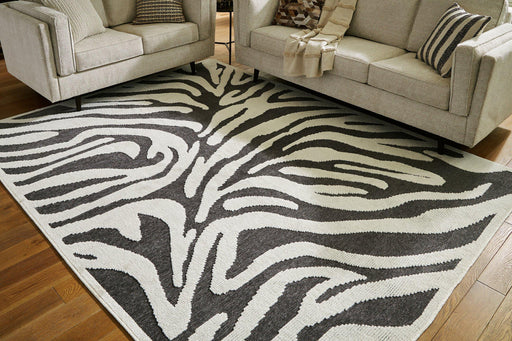 Thomwith 7'10" x 10'1" Rug - Premium Rug from Ashley Furniture - Just $249.76! Shop now at Furniture Wholesale Plus  We are the best furniture store in Nashville, Hendersonville, Goodlettsville, Madison, Antioch, Mount Juliet, Lebanon, Gallatin, Springfield, Murfreesboro, Franklin, Brentwood