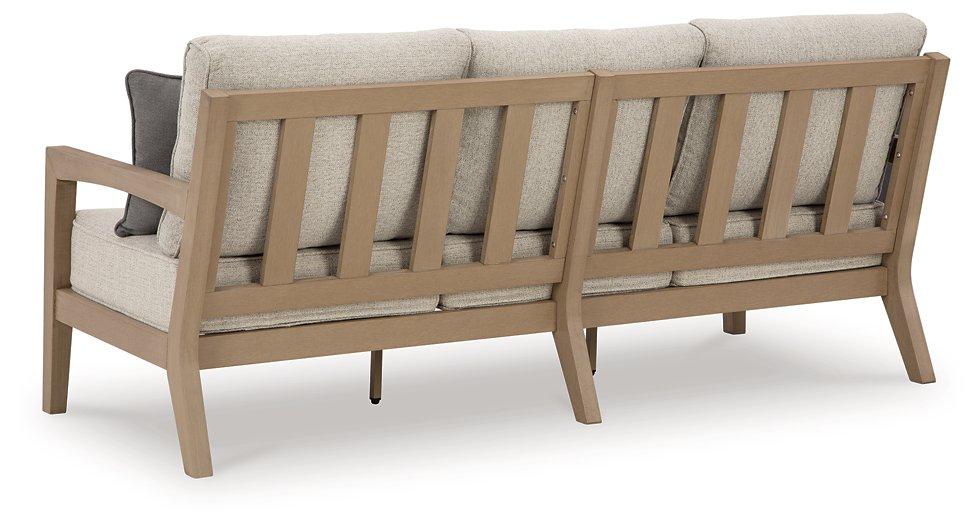 Hallow Creek Outdoor Sofa with Cushion - Premium Outdoor Seating from Ashley Furniture - Just $1637.95! Shop now at Furniture Wholesale Plus  We are the best furniture store in Nashville, Hendersonville, Goodlettsville, Madison, Antioch, Mount Juliet, Lebanon, Gallatin, Springfield, Murfreesboro, Franklin, Brentwood