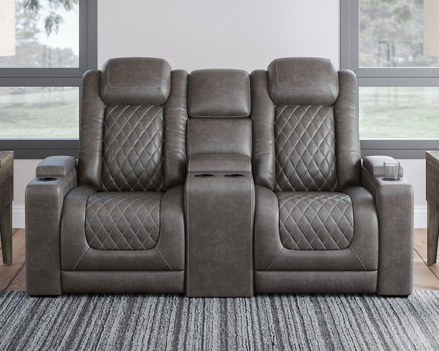 HyllMont Power Reclining Loveseat with Console - Premium Loveseat from Ashley Furniture - Just $1333.82! Shop now at Furniture Wholesale Plus  We are the best furniture store in Nashville, Hendersonville, Goodlettsville, Madison, Antioch, Mount Juliet, Lebanon, Gallatin, Springfield, Murfreesboro, Franklin, Brentwood