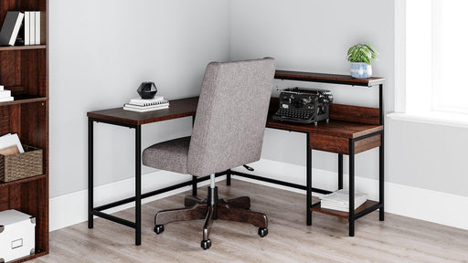 Camiburg Home Office L-Desk with Storage - Premium Desk from Ashley Furniture - Just $317.24! Shop now at Furniture Wholesale Plus  We are the best furniture store in Nashville, Hendersonville, Goodlettsville, Madison, Antioch, Mount Juliet, Lebanon, Gallatin, Springfield, Murfreesboro, Franklin, Brentwood