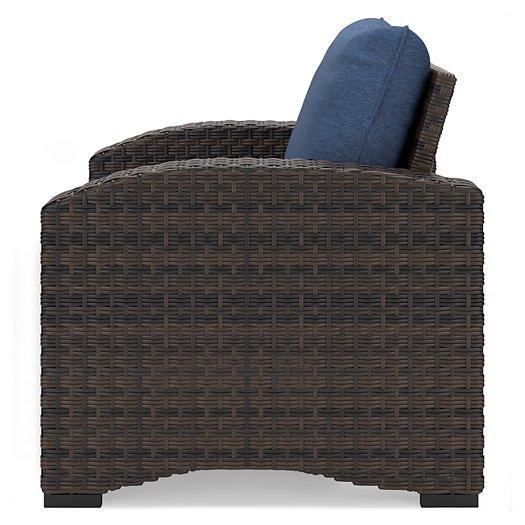 Windglow Outdoor Lounge Chair with Cushion - Premium Outdoor Seating from Ashley Furniture - Just $321.78! Shop now at Furniture Wholesale Plus  We are the best furniture store in Nashville, Hendersonville, Goodlettsville, Madison, Antioch, Mount Juliet, Lebanon, Gallatin, Springfield, Murfreesboro, Franklin, Brentwood