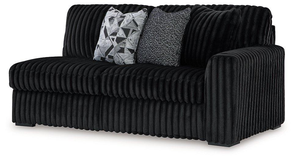 Midnight-Madness Sectional with Chaise - Premium Sectional from Ashley Furniture - Just $1572.08! Shop now at Furniture Wholesale Plus  We are the best furniture store in Nashville, Hendersonville, Goodlettsville, Madison, Antioch, Mount Juliet, Lebanon, Gallatin, Springfield, Murfreesboro, Franklin, Brentwood