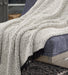 Leonita Throw - Premium Throw from Ashley Furniture - Just $39.17! Shop now at Furniture Wholesale Plus  We are the best furniture store in Nashville, Hendersonville, Goodlettsville, Madison, Antioch, Mount Juliet, Lebanon, Gallatin, Springfield, Murfreesboro, Franklin, Brentwood