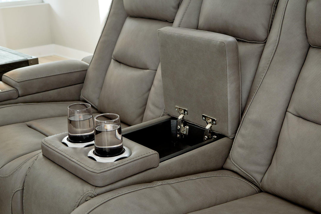 The Man-Den Power Reclining Loveseat with Console - Premium Loveseat from Ashley Furniture - Just $2152.97! Shop now at Furniture Wholesale Plus  We are the best furniture store in Nashville, Hendersonville, Goodlettsville, Madison, Antioch, Mount Juliet, Lebanon, Gallatin, Springfield, Murfreesboro, Franklin, Brentwood