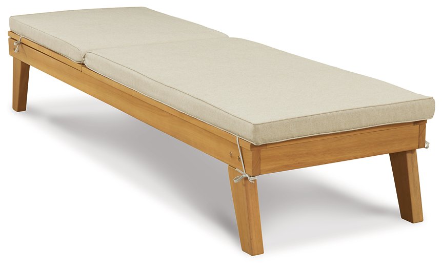 Byron Bay Chaise Lounge with Cushion - Premium Outdoor Seating from Ashley Furniture - Just $268.81! Shop now at Furniture Wholesale Plus  We are the best furniture store in Nashville, Hendersonville, Goodlettsville, Madison, Antioch, Mount Juliet, Lebanon, Gallatin, Springfield, Murfreesboro, Franklin, Brentwood