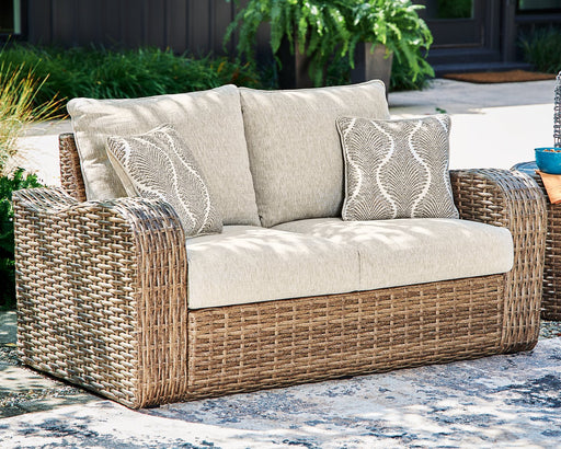 Sandy Bloom Outdoor Loveseat with Cushion - Premium Outdoor Seating from Ashley Furniture - Just $723! Shop now at Furniture Wholesale Plus  We are the best furniture store in Nashville, Hendersonville, Goodlettsville, Madison, Antioch, Mount Juliet, Lebanon, Gallatin, Springfield, Murfreesboro, Franklin, Brentwood