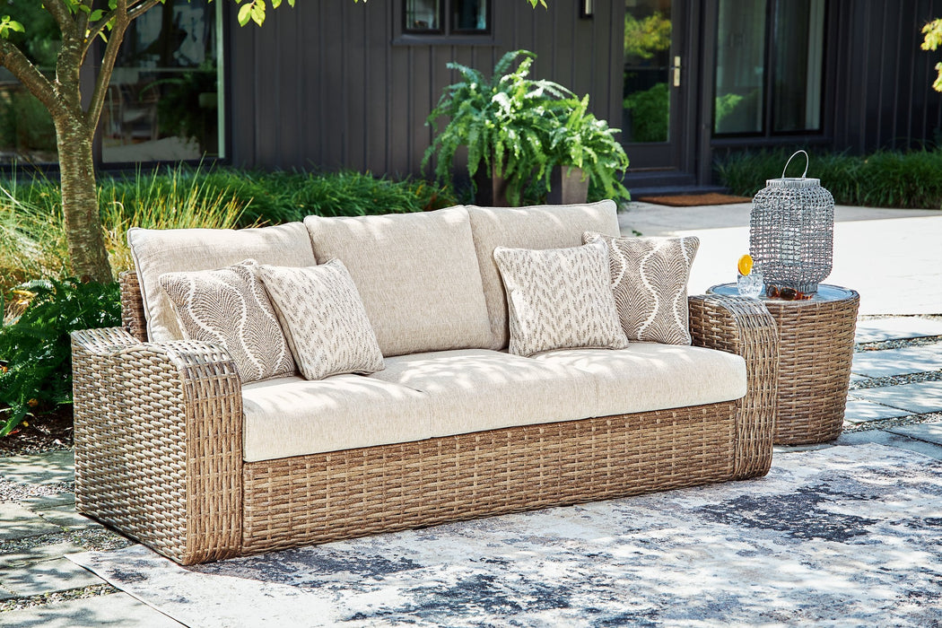 Sandy Bloom Outdoor Sofa with Cushion - Premium Outdoor Seating from Ashley Furniture - Just $1018.29! Shop now at Furniture Wholesale Plus  We are the best furniture store in Nashville, Hendersonville, Goodlettsville, Madison, Antioch, Mount Juliet, Lebanon, Gallatin, Springfield, Murfreesboro, Franklin, Brentwood