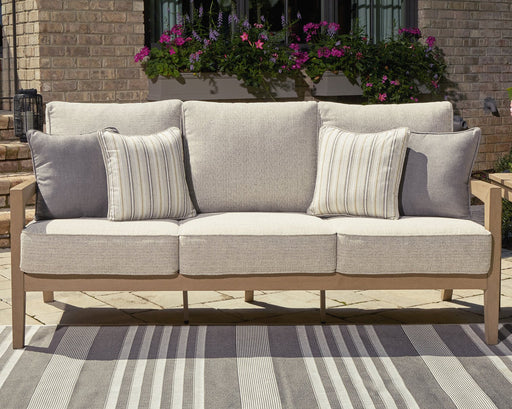 Hallow Creek Outdoor Sofa with Cushion - Premium Outdoor Seating from Ashley Furniture - Just $1592.05! Shop now at Furniture Wholesale Plus  We are the best furniture store in Nashville, Hendersonville, Goodlettsville, Madison, Antioch, Mount Juliet, Lebanon, Gallatin, Springfield, Murfreesboro, Franklin, Brentwood