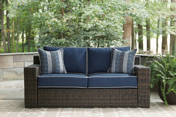 Grasson Lane Loveseat with Cushion - Premium Outdoor Seating from Ashley Furniture - Just $811.27! Shop now at Furniture Wholesale Plus  We are the best furniture store in Nashville, Hendersonville, Goodlettsville, Madison, Antioch, Mount Juliet, Lebanon, Gallatin, Springfield, Murfreesboro, Franklin, Brentwood
