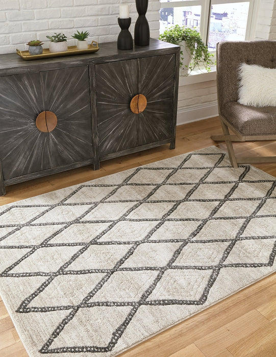 Jarmo 5' x 7' Rug - Premium Rug from Ashley Furniture - Just $125.67! Shop now at Furniture Wholesale Plus  We are the best furniture store in Nashville, Hendersonville, Goodlettsville, Madison, Antioch, Mount Juliet, Lebanon, Gallatin, Springfield, Murfreesboro, Franklin, Brentwood