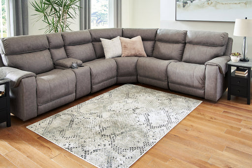 Poincilana 7'10" x 9'10" Rug - Premium Rug from Ashley Furniture - Just $366.28! Shop now at Furniture Wholesale Plus  We are the best furniture store in Nashville, Hendersonville, Goodlettsville, Madison, Antioch, Mount Juliet, Lebanon, Gallatin, Springfield, Murfreesboro, Franklin, Brentwood