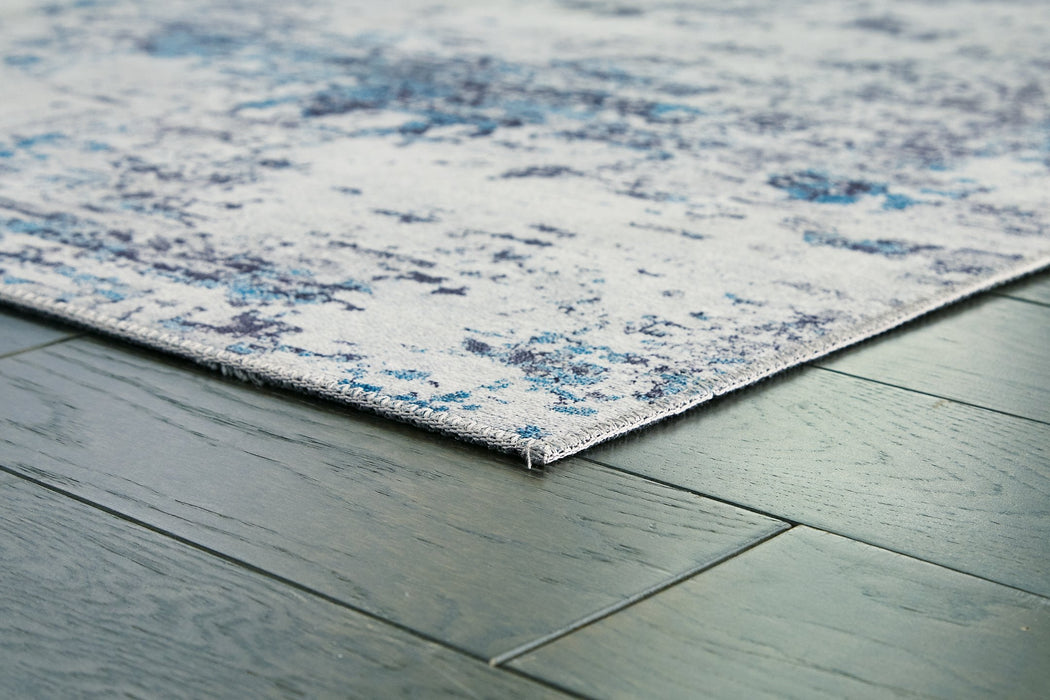 Putmins 5' x 7' Rug - Premium Rug from Ashley Furniture - Just $72.71! Shop now at Furniture Wholesale Plus  We are the best furniture store in Nashville, Hendersonville, Goodlettsville, Madison, Antioch, Mount Juliet, Lebanon, Gallatin, Springfield, Murfreesboro, Franklin, Brentwood