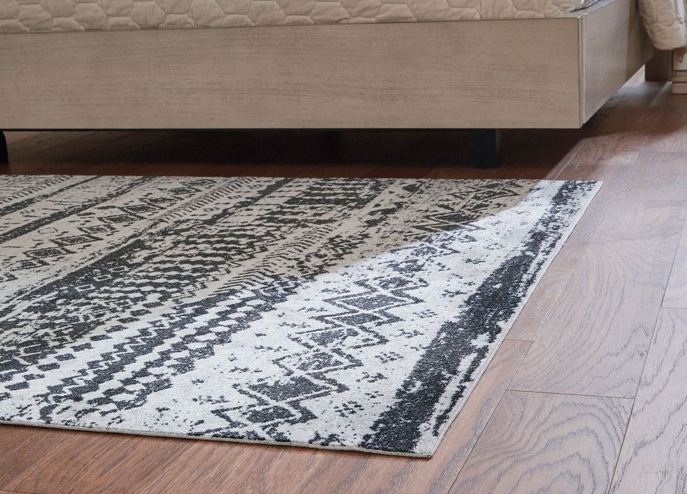 Devman 5'2" x 6'10" Rug - Premium Rug from Ashley Furniture - Just $90.36! Shop now at Furniture Wholesale Plus  We are the best furniture store in Nashville, Hendersonville, Goodlettsville, Madison, Antioch, Mount Juliet, Lebanon, Gallatin, Springfield, Murfreesboro, Franklin, Brentwood