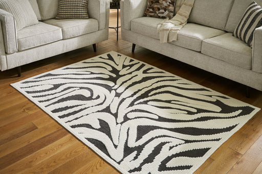 Thomwith 4'11" x 7'2" Rug - Premium Rug from Ashley Furniture - Just $116.84! Shop now at Furniture Wholesale Plus  We are the best furniture store in Nashville, Hendersonville, Goodlettsville, Madison, Antioch, Mount Juliet, Lebanon, Gallatin, Springfield, Murfreesboro, Franklin, Brentwood