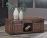 Budmore Coffee Table - Premium Cocktail Table from Ashley Furniture - Just $378.01! Shop now at Furniture Wholesale Plus  We are the best furniture store in Nashville, Hendersonville, Goodlettsville, Madison, Antioch, Mount Juliet, Lebanon, Gallatin, Springfield, Murfreesboro, Franklin, Brentwood