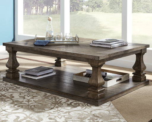 Johnelle Coffee Table - Premium Cocktail Table from Ashley Furniture - Just $395.67! Shop now at Furniture Wholesale Plus  We are the best furniture store in Nashville, Hendersonville, Goodlettsville, Madison, Antioch, Mount Juliet, Lebanon, Gallatin, Springfield, Murfreesboro, Franklin, Brentwood