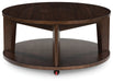 Korestone 2 - Round Cocktail Table - Dark Brown – Coffee Tables by Signature Design by Ashley® at Furniture Wholesale Plus , Nashville furniture store