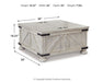 Carynhurst - Cocktail Table with Storage - Whitewash – Cocktail Tables by Signature Design by Ashley® at Furniture Wholesale Plus , Nashville furniture store