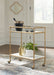 Plattfield - Antique Gold Finish - Bar Cart - Premium Bar Carts from Signature Design by Ashley® - Just $258! Shop now at Furniture Wholesale Plus  We are the best furniture store in Nashville, Hendersonville, Goodlettsville, Madison, Antioch, Mount Juliet, Lebanon, Gallatin, Springfield, Murfreesboro, Franklin, Brentwood
