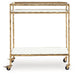Plattfield - Antique Gold Finish - Bar Cart - Premium Bar Carts from Signature Design by Ashley® - Just $258! Shop now at Furniture Wholesale Plus  We are the best furniture store in Nashville, Hendersonville, Goodlettsville, Madison, Antioch, Mount Juliet, Lebanon, Gallatin, Springfield, Murfreesboro, Franklin, Brentwood