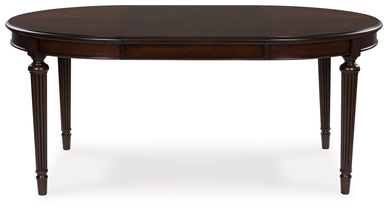 Lavinton - Oval Dining Room Extension Table - Brown – Dining Tables with Extensions by Signature Design by Ashley® at Furniture Wholesale Plus , Nashville furniture store