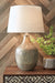 Mari - Gray / Gold Finish - Glass Table Lamp - Premium Table Lamps from Signature Design by Ashley® - Just $148! Shop now at Furniture Wholesale Plus  We are the best furniture store in Nashville, Hendersonville, Goodlettsville, Madison, Antioch, Mount Juliet, Lebanon, Gallatin, Springfield, Murfreesboro, Franklin, Brentwood