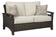 Paradise Trail - Medium Brown - Loveseat w/Cushion - Premium Loveseats from Signature Design by Ashley® - Just $1138! Shop now at Furniture Wholesale Plus  We are the best furniture store in Nashville, Hendersonville, Goodlettsville, Madison, Antioch, Mount Juliet, Lebanon, Gallatin, Springfield, Murfreesboro, Franklin, Brentwood