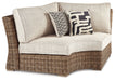 Beachcroft - Curved Corner Chair w/Cushion - Beige – Armless Chairs by Signature Design by Ashley® at Furniture Wholesale Plus , Nashville furniture store