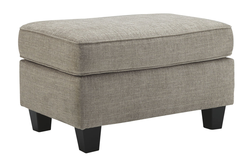 Kestrel - Ottoman - Driftwood – Upholstered Ottomans by Ashley® at Furniture Wholesale Plus , Nashville furniture store