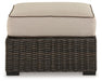 Coastline Bay - Brown - Ottoman With Cushion - Premium Ottomans from Signature Design by Ashley® - Just $298! Shop now at Furniture Wholesale Plus  We are the best furniture store in Nashville, Hendersonville, Goodlettsville, Madison, Antioch, Mount Juliet, Lebanon, Gallatin, Springfield, Murfreesboro, Franklin, Brentwood