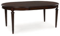 Lavinton - Oval Dining Room Extension Table - Brown – Dining Tables with Extensions by Signature Design by Ashley® at Furniture Wholesale Plus , Nashville furniture store