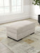 High Profile - Ottoman - Taupe – Upholstered Ottomans by Benchcraft® at Furniture Wholesale Plus , Nashville furniture store