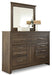 Juararo Dresser and Mirror - Premium Dresser and Mirror from Ashley Furniture - Just $603.33! Shop now at Furniture Wholesale Plus  We are the best furniture store in Nashville, Hendersonville, Goodlettsville, Madison, Antioch, Mount Juliet, Lebanon, Gallatin, Springfield, Murfreesboro, Franklin, Brentwood